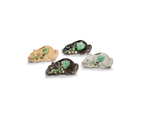 FOUR ENAMELLED BISCUIT 'SQUIRREL' WATERDROPPERSKangxiEach glazed biscuit figure modelled crouching and holding a fruiting ste