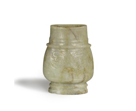 AN ARCHAISTIC JADE VASE, HUMing dynastyOf compressed form, finely incised to each side with a taotie mask within raised rope 
