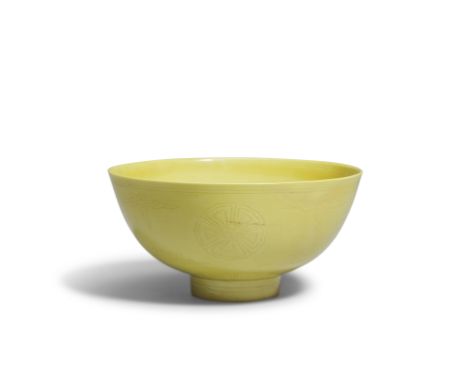 A YELLOW-GLAZED FLORAL BOWLKangxi six-character mark and of the periodThe exterior incised with four floral medallions altern