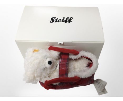 A Steiff Lizzy teddy bear in carry basket, with tags and original box.