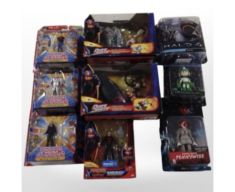 Nine Mattel and Funko figurines including Superman, Megaman, Halo, etc., boxed,