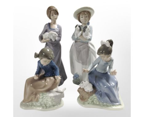Four Nao figures of girls, tallest 26cm.