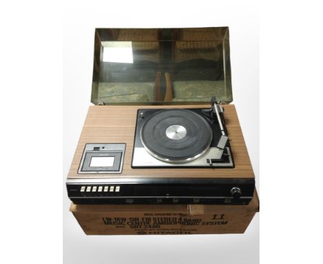 A Hitatchi stereo four-band music centre ambiophonic system model SDT-2480 with Garrard SP25 Mk IV turntable, with original b
