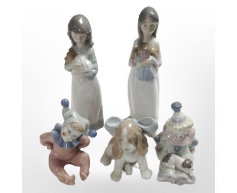 A Lladró figure of a seated clown and four further Nao figures, tallest 23cm.