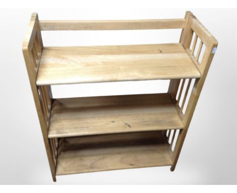 A contemporary pine three-tier shelf, width 70cm.