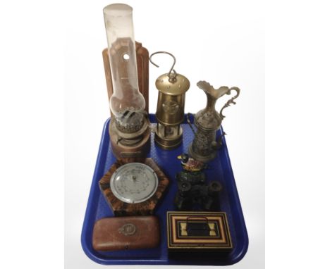 A Welsh brass miner's lamp, a further oil lamp, vintage spectacles case with silver mounts, small cast-iron doorstop, vintage