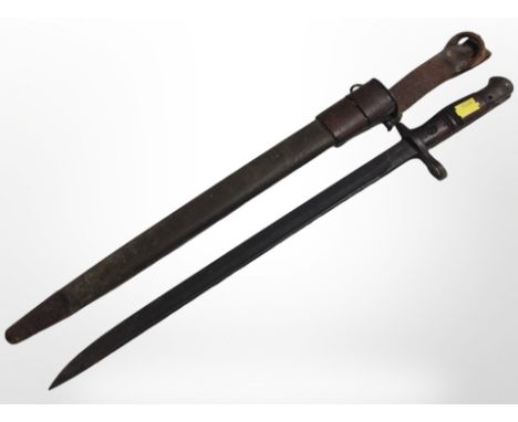 An American WWI Remington bayonet with 43cm single-edged blade, dated 1918, in scabbard.