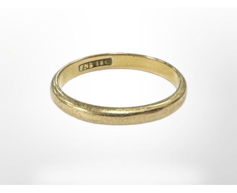 An 18ct yellow gold band ring, size M. CONDITION REPORT: 2.1g