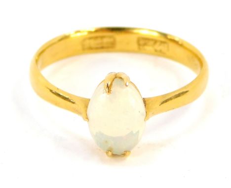 An opal dress ring, with oval opal set in claw setting on a yellow metal band, with Chinese hallmarks (valued as 9ct gold), s