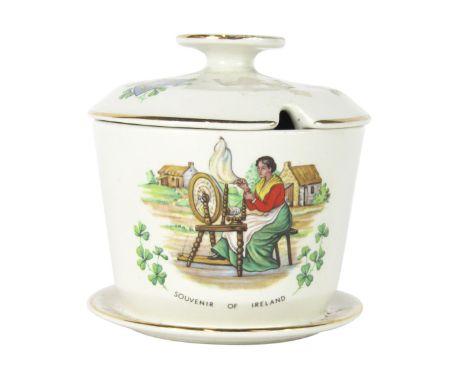 A Beswick Souvenir of Ireland jar and cover, with applied harp and clover detailing, stamped Beswick, No 1968, 10cm high.