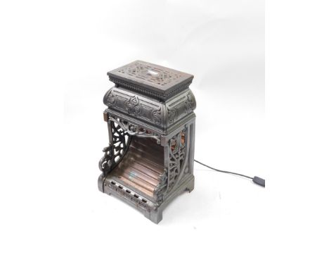 An Oxford late 19thC cast iron and copper heater, with cast foliate scroll decoration, converted to an electric lamp, 49cm hi