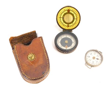 A World War One period officer's wrist type compass, together with one other example. (2)