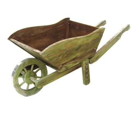 A wooden wheelbarrow planter, 41cm high, 90cm wide.