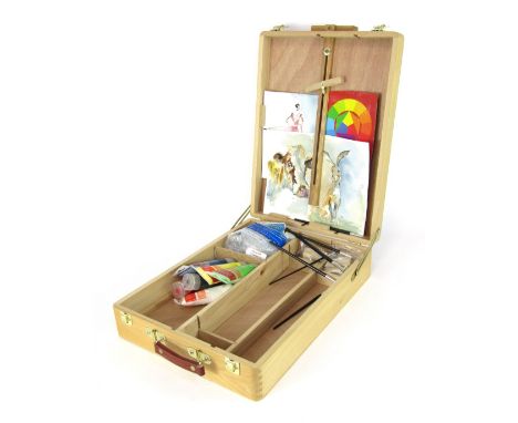 A beech travelling artist's carry case, converting to an easel.