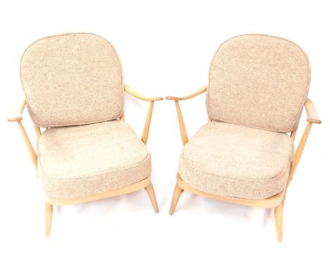 A pair of Ercol light elm and beech lounge chairs, model 203, each with taupe cushions, 85cm high, 72cm wide, 65cm deep.