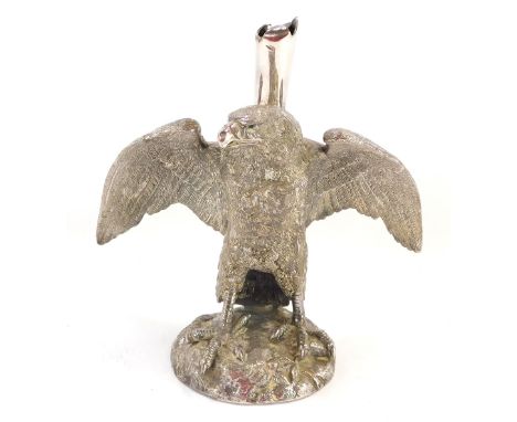 A silver plated eagle epergne stand, perched on a rock with fluted top, faint stamp to underside, 20cm high. 