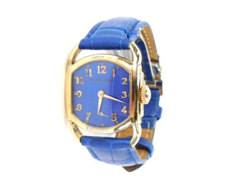 A Hamilton ladies dress watch, the square dial with blue enamel backing, gold coloured hands with seconds dial, in a 10ct gol