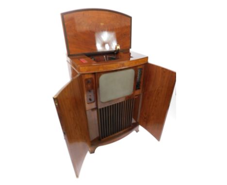 A rare walnut cased Decca Model 300 Television Radio Gram retailed by Harrod's, the doors opening to reveal a fitted TV scree