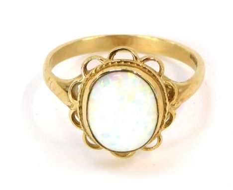 A 9ct gold opal dress ring, in a floral cluster with single oval opal in a rub over setting, with rope twist outer border, si