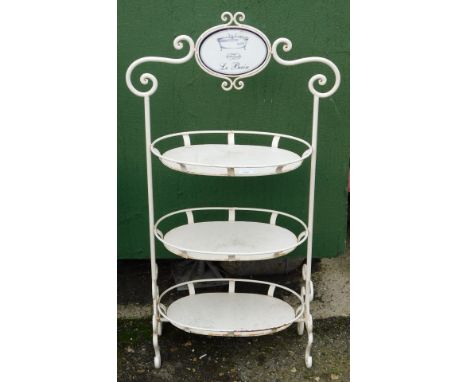 A Labane cast metal bathroom three shelved unit, with enamel top plaque, and scroll detailed supports, 111cm high.