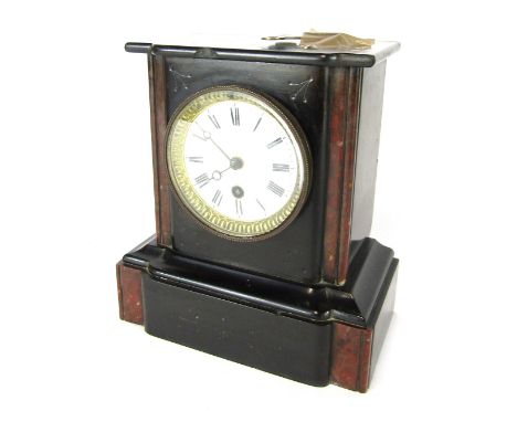 A 19thC French black slate mantel clock, the shaped top on two column supports, with applied red marble detailing, on a white