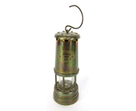 A Lamp and Limelight miner's lamp, with Hockley Colliery stamp, in brass casing with carry hook, 22cm high.