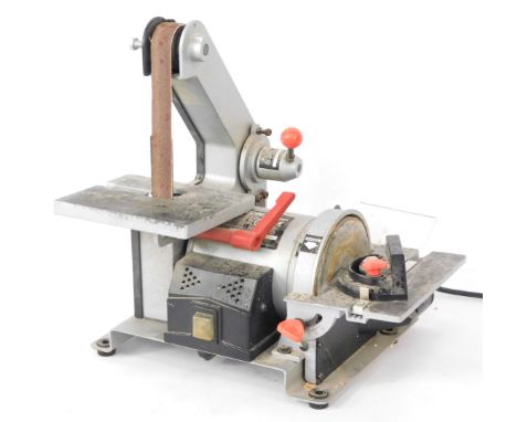 A Nixon belt sander, model BD150BQ, with additional belts.