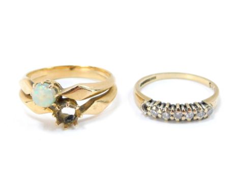 Two rings, comprising a 9ct gold and cz set half hoop eternity ring, ring size K, 1.4g all in and a dress ring set with two s