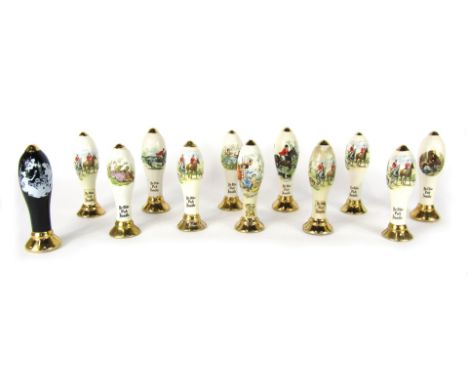 Twelve Mead ceramic beer pump handles, depicting various hunting scenes, 15cm high.