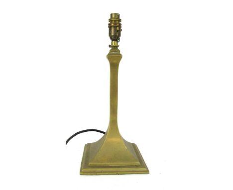 A loaded brass table lamp, on a plain column support, and out swept square base, 43cm high.