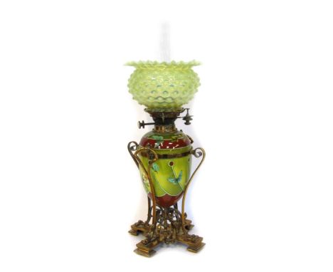 A Victorian pottery oil lamp, the green vaseline glass flared shade, a chimney on a ceramic Doulton Art Nouveau style body, w