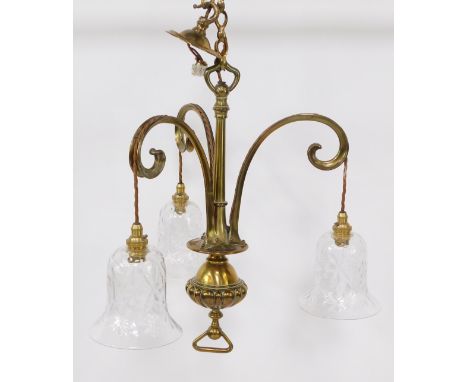 A brass three branch hanging chandelier, with chain drop, on stem and fluted bulbous centre, with floral cut glass bell shape