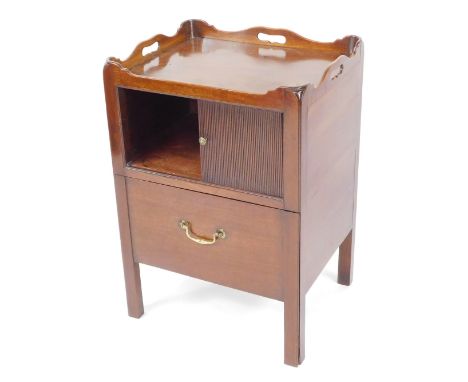 A George III mahogany commode, the galleried tray top above a tambour door, over a single pull out drawer, raised on tapering