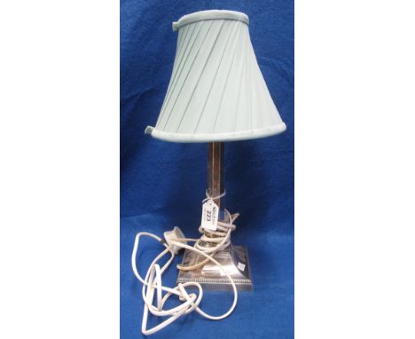 Silver table lamp having tapering faceted column on a square loaded base with shade. Sheffield hallmark. (B.P. 24% incl. VAT)