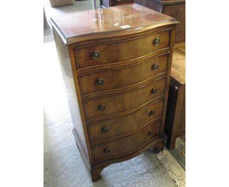 Reproduction mahogany narrow serpentine chest of five drawers on bracket feet with label for Bevan Funnell.(B.P. 24% incl. VA