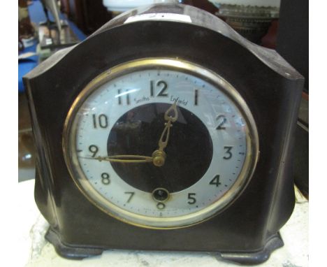 Mid century Smiths round Bakelite mantle clock, the face with Arabic numeral and having key and pendulum.(B.P. 24% incl. VAT)
