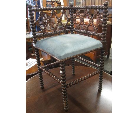 Stained bobbin turned upholstered corner chair. (B.P. 24% incl. VAT)