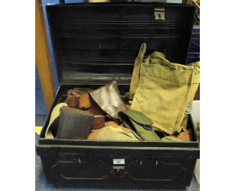 Tin trunk containing assorted Army webbing, Sam Browne belts, pistol holsters, haversacks, uniform and camouflage items etc. 