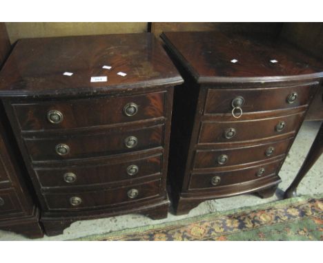 Pair of reproduction mahogany bow front narrow chests of four drawers on bracket feet. (2)(B.P. 24% incl. VAT)