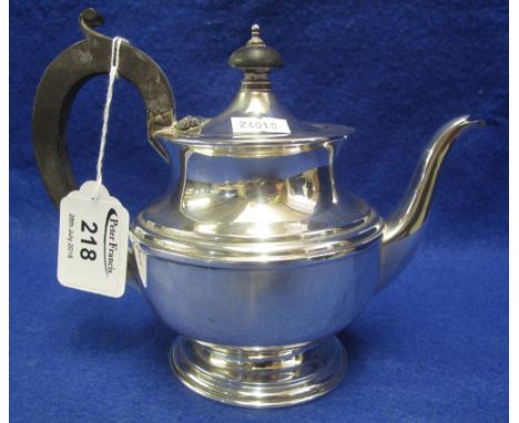 Silver baluster shaped bachelor's teapot with hinged cover having ebony finial and ebony loop handle. Birmingham hallmark, 8.