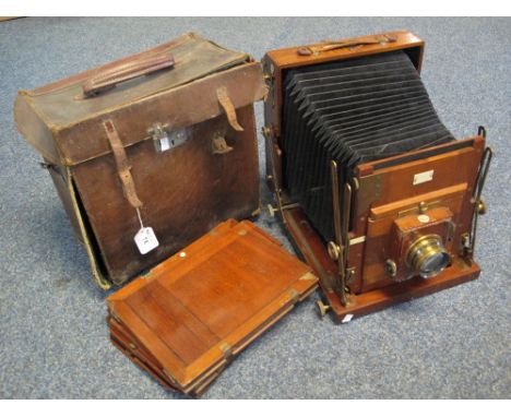Ensign mahogany and brass studio plate camera with four mahogany dark slides, in leather case. (B.P. 24% incl. VAT)