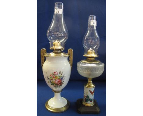Brass single burner oil lamp with urn shaped ceramic body painted with flowers on a pedestal base with clear shade.  Together