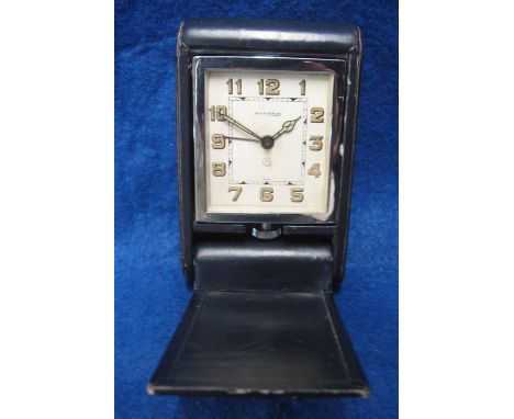 Jaeger Le Coultre Art Deco design folding travel alarm clock with Arabic face in blue leather covered case. (B.P. 24% incl. V