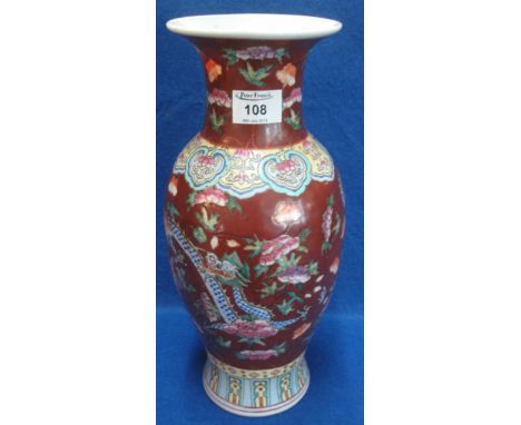 Chinese porcelain polychrome decorated red ground vase overall decorated with dragons, peonies and other flowers.  Stamped 6 