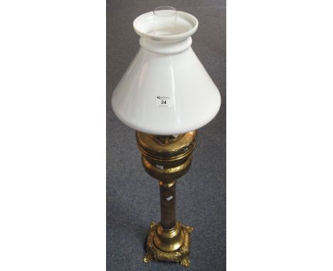 Large brass oil lamp with tall pedestal base, in Eastern style, having conical white glass chimney, white glass shade and cle