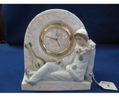 Lladro porcelain mantle clock with pierrette figure.  Printed marks.  21 cm high approximately.(B.P. 24% incl. VAT)   CONDITI