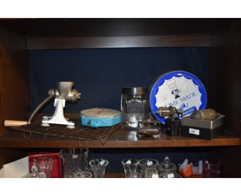 A collection of kitchenalia, including piping set, mincer and scales.