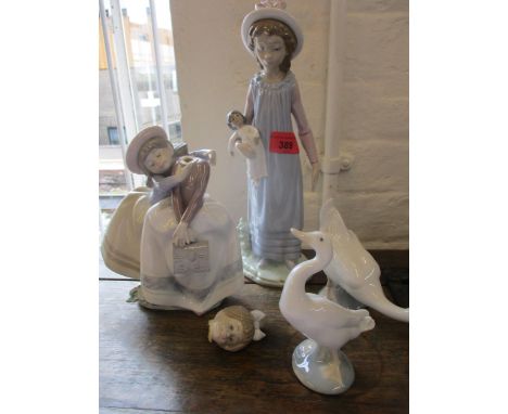 Three items of Lladro and a model of a Nao gooseCondition: One Lladro figure has a broken head 