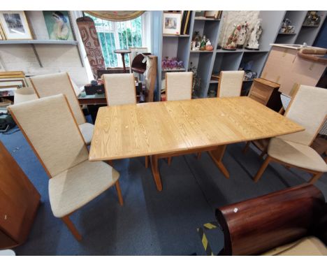 A modern Ercol dining table with extending butterfly leaf, 72 h x 200 w x 92cm d, with six dining chairsLocation: LAB 