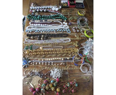 A quantity of vintage jewellery to include a green agate bead necklace, mixed earrings and rings Location: Porters 